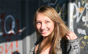 18 year old girl Katie Lewis stands naked after undressing in her bedroom